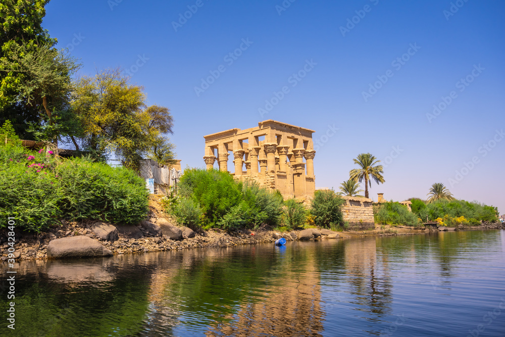 The beautiful temple of Philae and the Greco-Roman buildings seen from the Nile river, a temple dedicated to Isis, goddess of love. Aswan. Egyptian The beautiful temple of Philae and the Greco-Roman buildings seen from the Nile river, a temple dedicated to Isis, goddess of love. Aswan. Egyptian