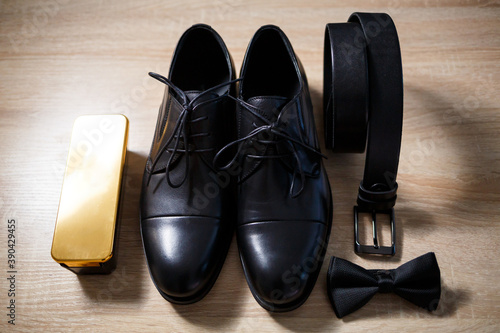 Morning details of a stylish groom with leather shoes