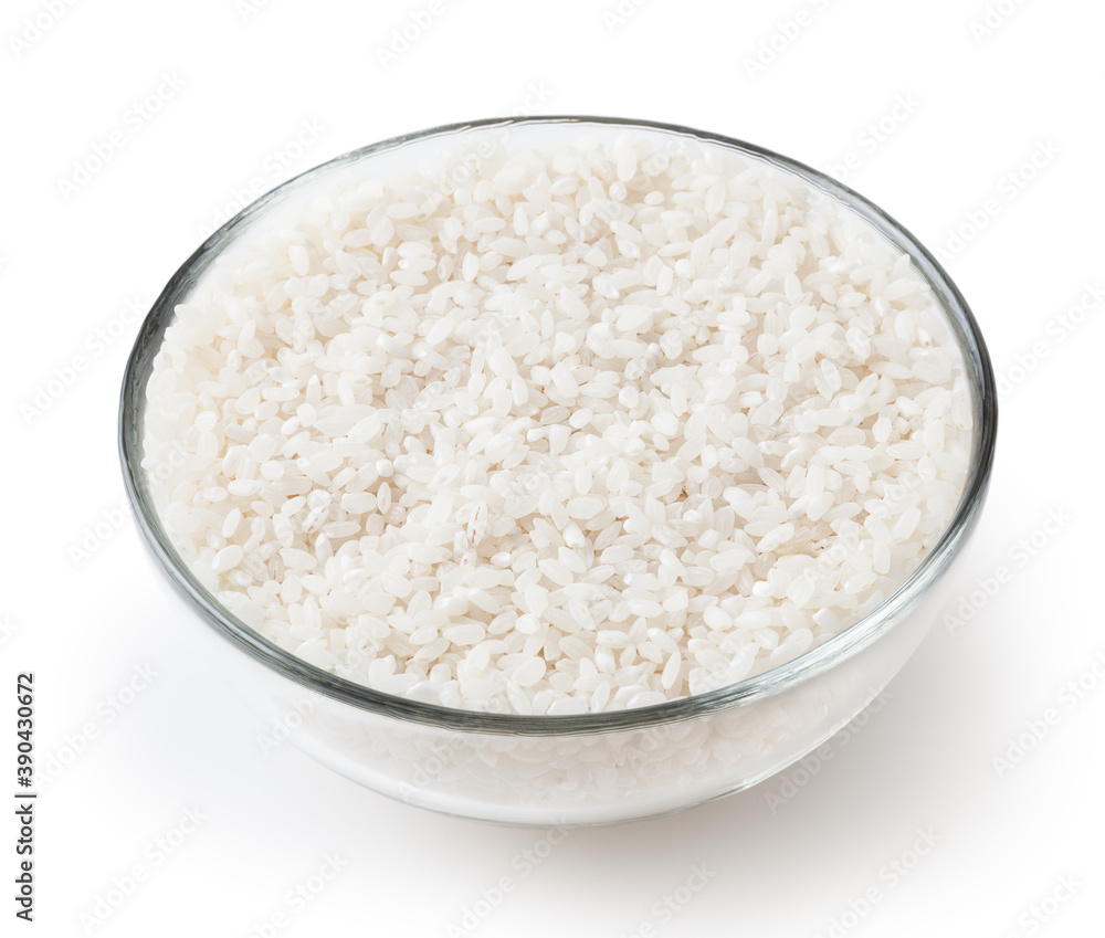 Uncooked round rice in glass bowl isolated on white background with clipping path Uncooked round rice in glass bowl isolated on white background with clipping path