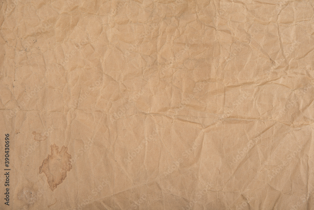 Obraz premium Brown crumpled paper with stains for background