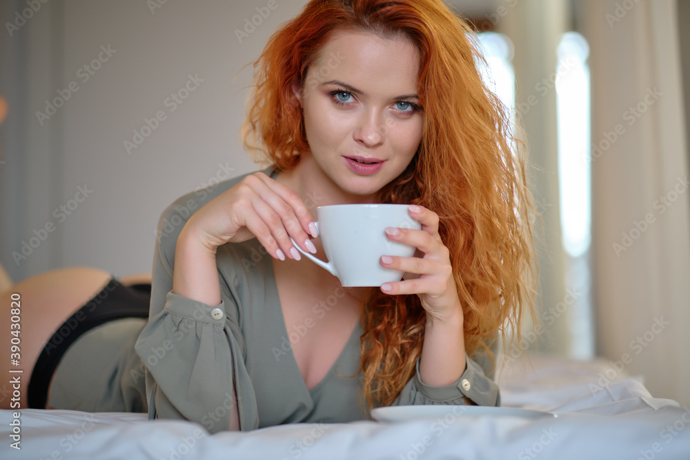 Beautiful young woman with cup of coffee at home Beautiful young woman with cup of coffee at home