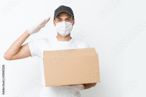 Delivery man holding cardboard boxes in medical rubber gloves and mask. copy space. Fast and free Delivery transport . Online shopping and Express delivery . Quarantine © Angelov