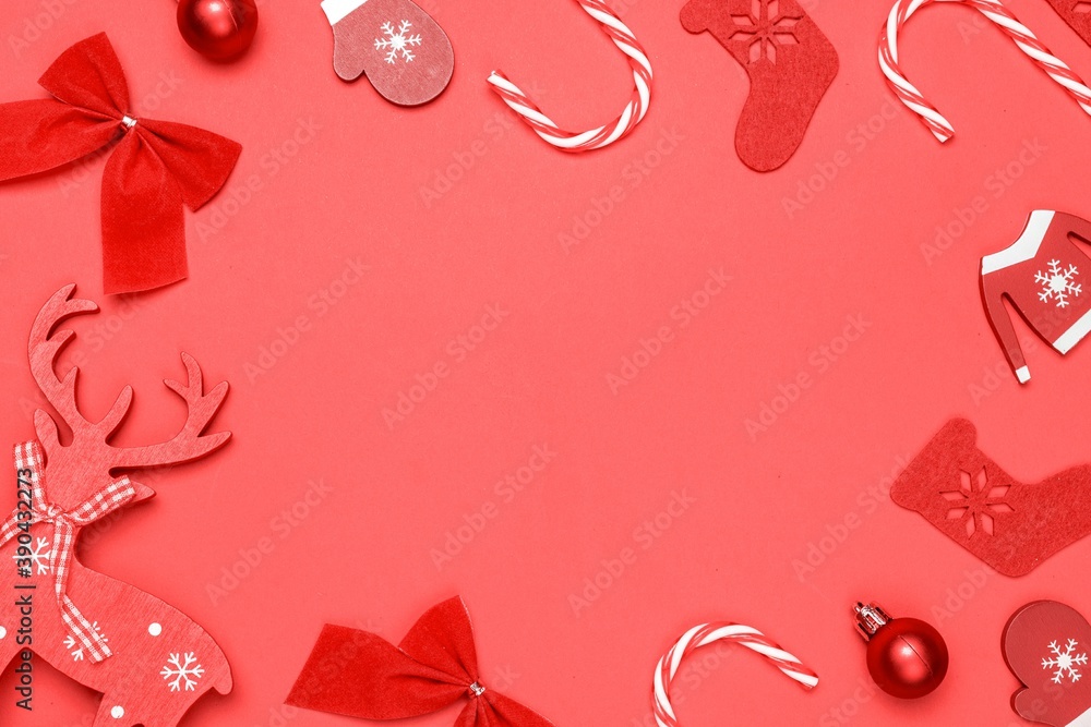 Christmas decoration red background. Stocking, gifts, winter tree, ribbon and bow in shape frame on red background for greeting card. Xmas backdrop with space for text. Christmas decoration red background. Stocking, gifts, winter tree, ribbon and bow in shape frame on red background for greeting card. Xmas backdrop with space for text.