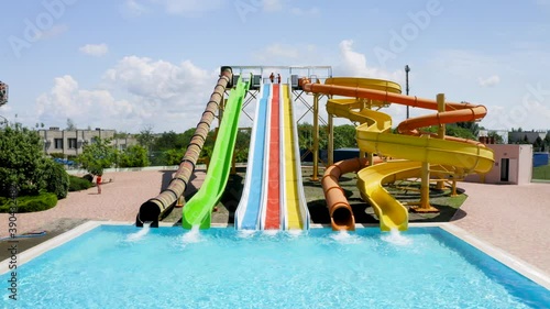 Wallpaper Mural Chornomorka, Ukraine - July 22, 2020: Water park with bright slides, swimming pool and people on sunny day Torontodigital.ca