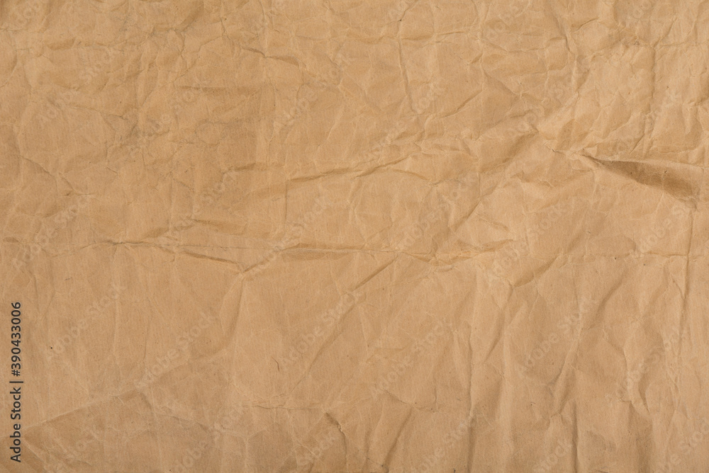 Fototapeta premium Brown crumpled paper with stains for background