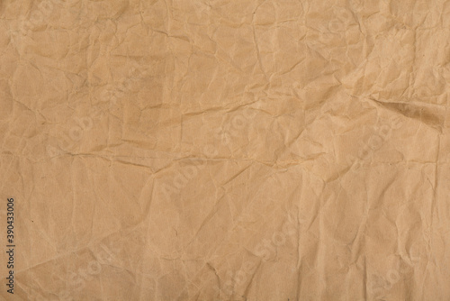 Brown crumpled paper with stains for background