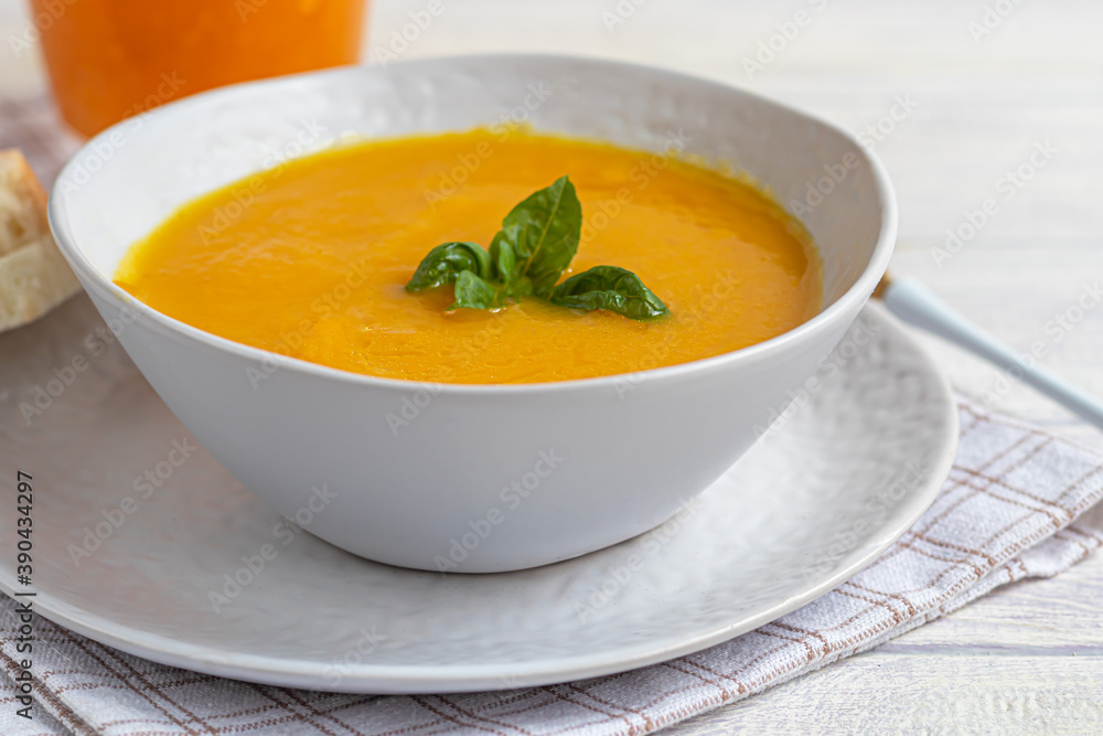 Fresh pumpkin cream soup with sour cream. Autumn lunch concept. A dietary, healthy dish. Fresh pumpkin cream soup with sour cream. Autumn lunch concept. A dietary, healthy dish.