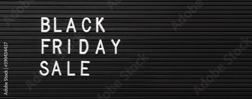 Black Friday sale white text lettering on black background of Letter Board. Black and white letters message promotion banner. Long web banner with copy space. Top view