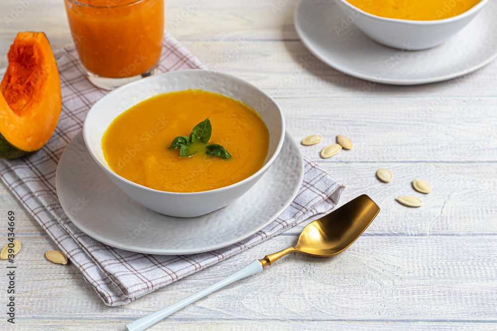 Fresh pumpkin cream soup with sour cream. Autumn lunch concept. A dietary, healthy dish. Fresh pumpkin cream soup with sour cream. Autumn lunch concept. A dietary, healthy dish.