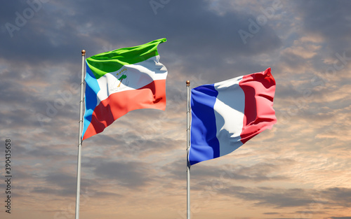 Beautiful national state flags of Equatorial Guinea and France together at the sky background. 3D artwork concept.