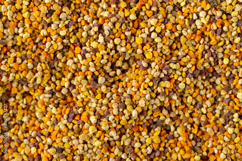 Organic bee pollen granules background top view Organic bee pollen granules background top view
