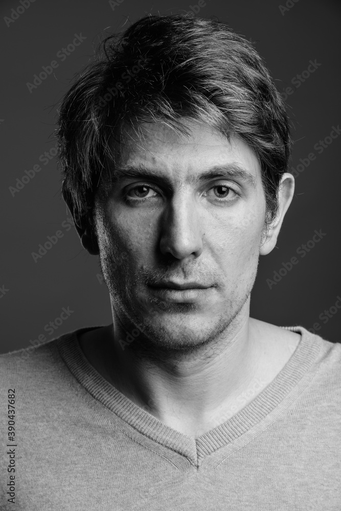 Portrait of handsome man against gray background Portrait of handsome man against gray background