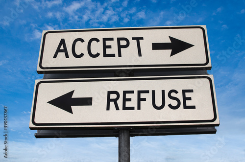 Accept vs refuse. White two street signs with arrow on metal pole with word. Directional road. Crossroads Road Sign, Two Arrow. Blue sky background. Two way road sign with text.