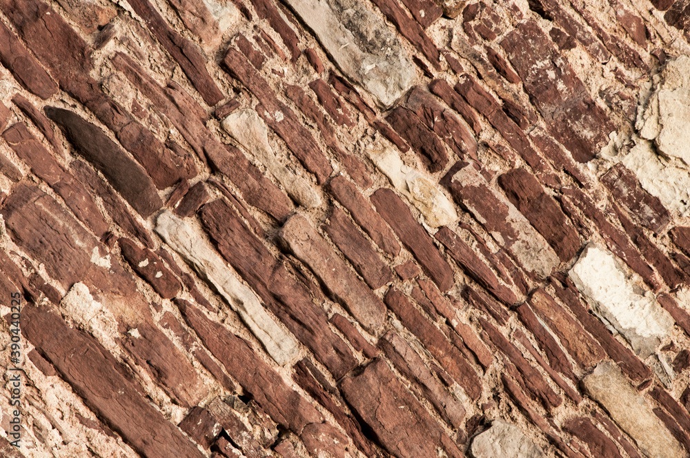 stone old wall. brickwork on the building. brown loft-style surface. dark creative background. clinker texture stone old wall. brickwork on the building. brown loft-style surface. dark creative background. clinker texture