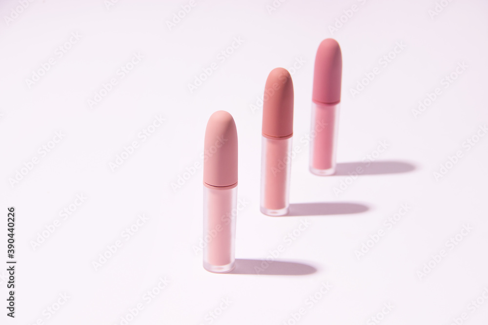 Set of lipsticks matte pink on a white background. Minimalism Set of lipsticks matte pink on a white background. Minimalism