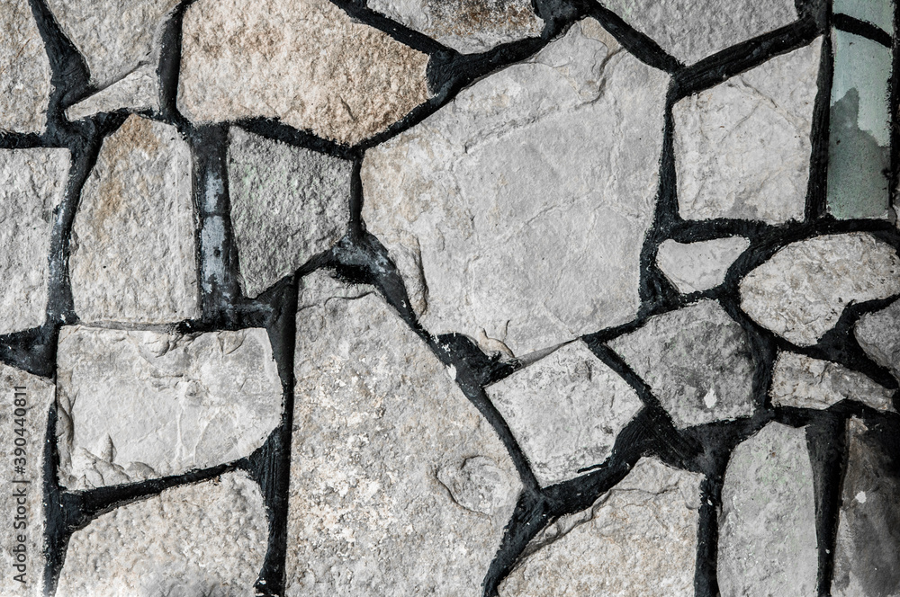Obraz premium stacked huge cobblestones. texture with boulders. wall with gray stones. creative light background