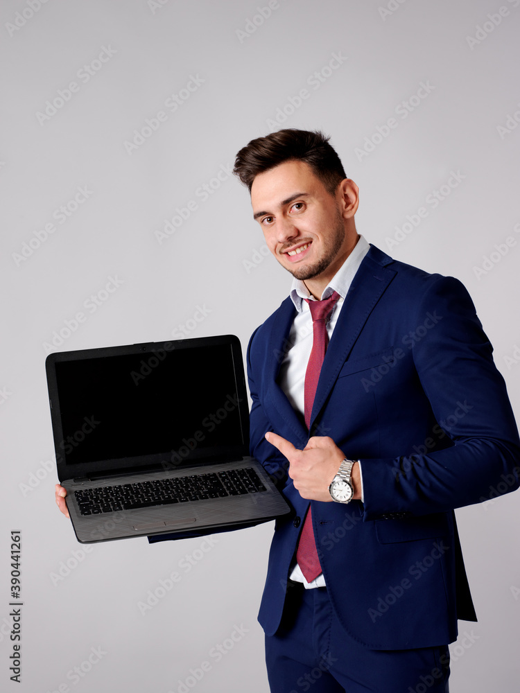 Young stylish man shows his computer screen Young stylish man shows his computer screen
