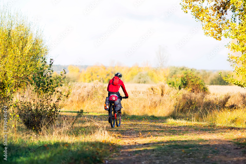 Camino de Santiago to Compostela with pilgrim on bike in Leon province , Spain Camino de Santiago to Compostela with pilgrim on bike in Leon province , Spain