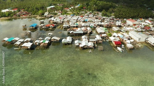 Wallpaper Mural Fishing village with wooden houses standing on stilts in the sea from above. Dapa, Siargao, Philippines. Torontodigital.ca