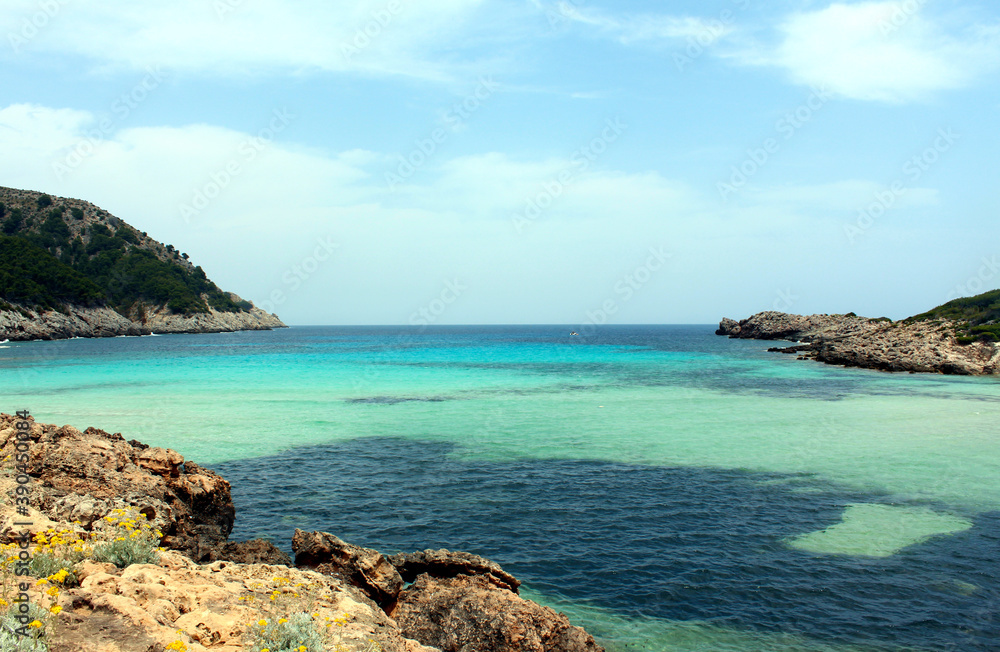Beautiful landscape with clear blue water and cloudy skies. Mediterranean Sea, Majorca Island, Spain.