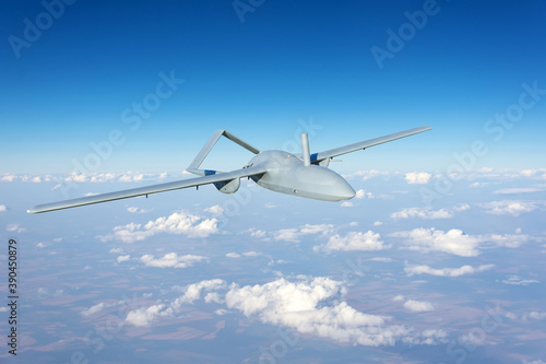 Unmanned military drone uav flying reconnaissance in the air high in the sky in the border areas.