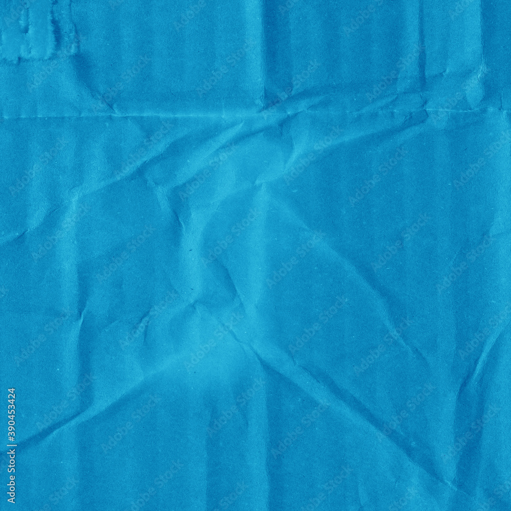 Obraz premium A blue vintage rough sheet of carton. Recycled environmentally friendly cardboard paper texture. Simple minimalist papercraft background.