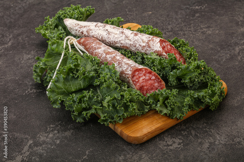 Spanish Fuet sausage with salad leaves