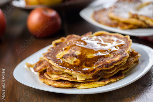 homemade pancakes with apples poured with honey.