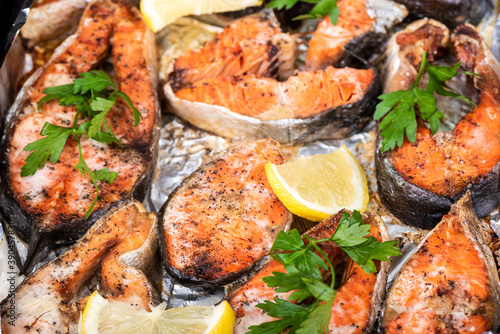 Soft focus. Baked chum salmon steaks with skin in the oven on foil.