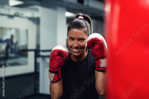 Young woman doing boxing training at the gym. © zorandim75