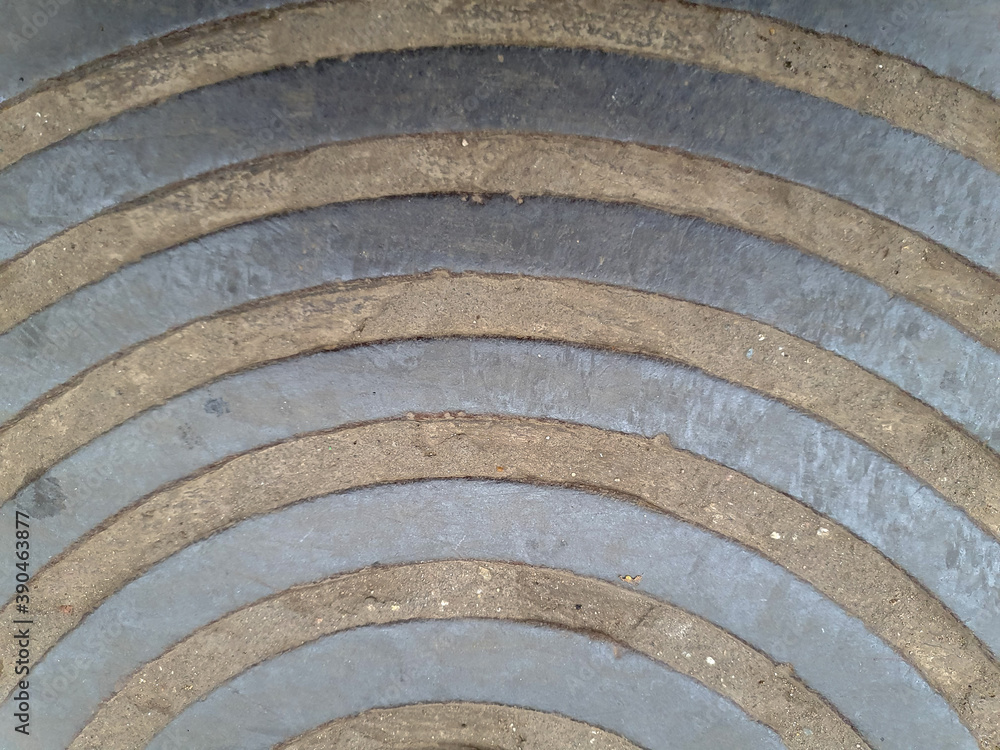 The texture of a metal plate with a radial pattern. The texture of a metal plate with a radial pattern.