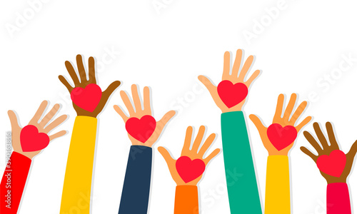 Charity, volunteering and donating concept. Raised up human hands with red hearts. Children's hands are holding heart symbols