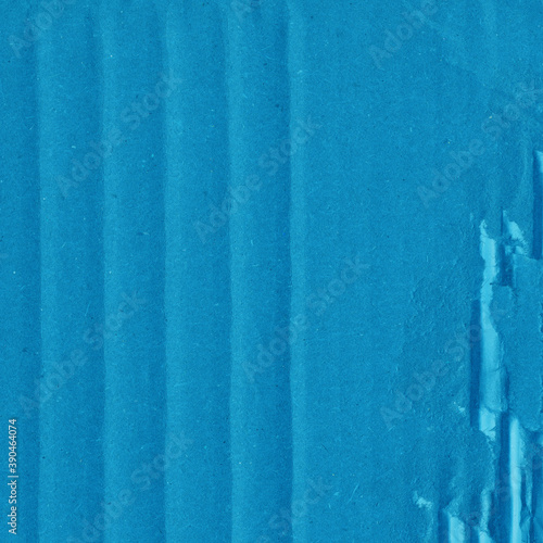 A blue vintage rough sheet of carton. Recycled environmentally friendly cardboard paper texture. Simple minimalist papercraft background.