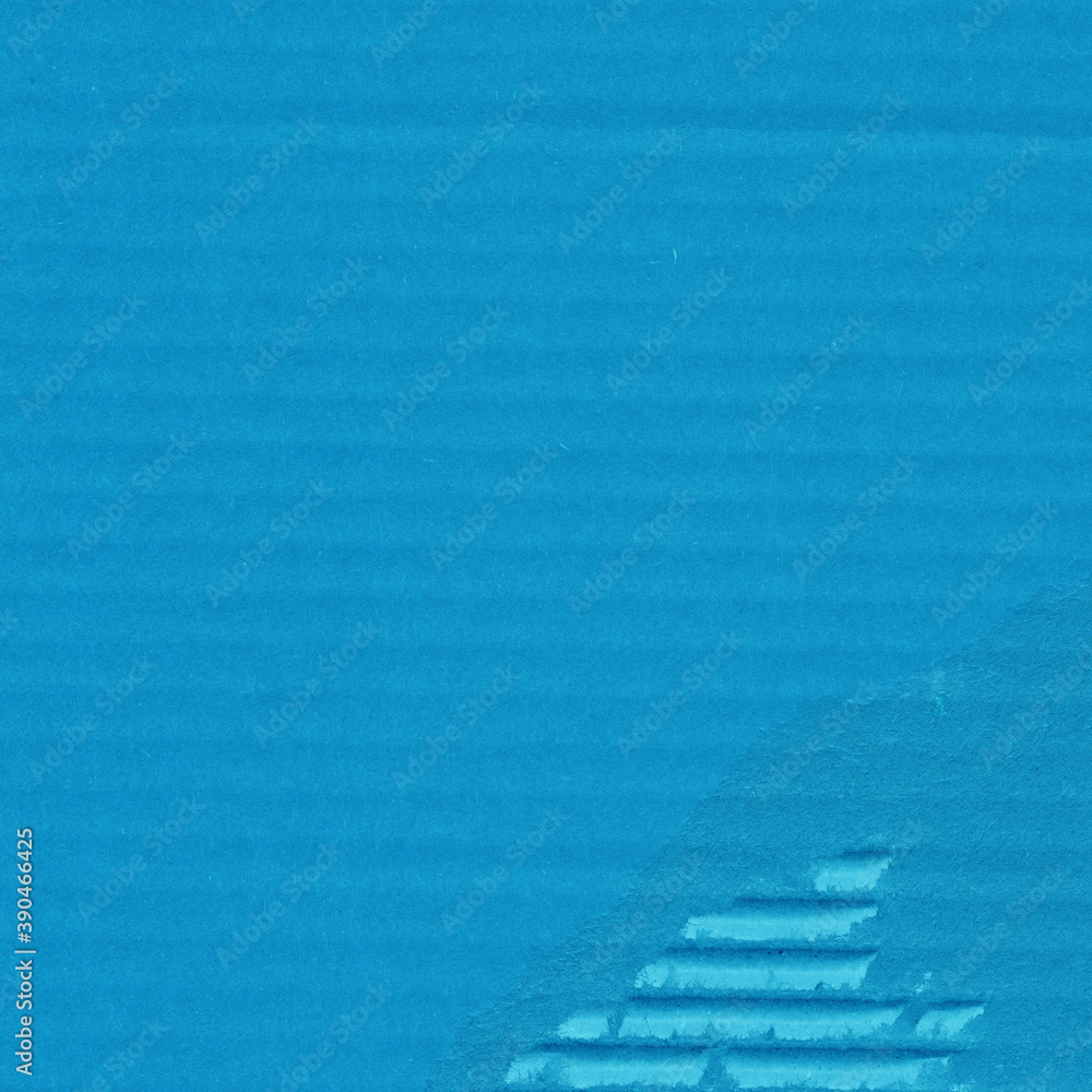 Obraz premium A blue vintage rough sheet of carton. Recycled environmentally friendly cardboard paper texture. Simple minimalist papercraft background.