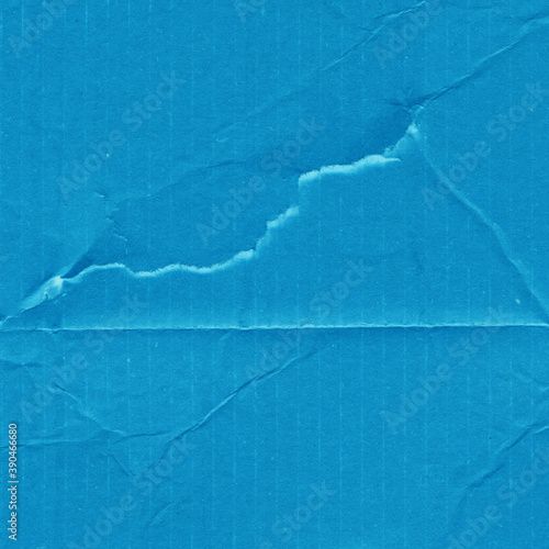 A blue vintage rough sheet of carton. Recycled environmentally friendly cardboard paper texture. Simple minimalist papercraft background.