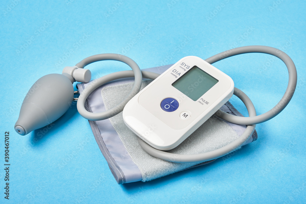blood pressure monitor on a blue background blood pressure monitor on a blue background
