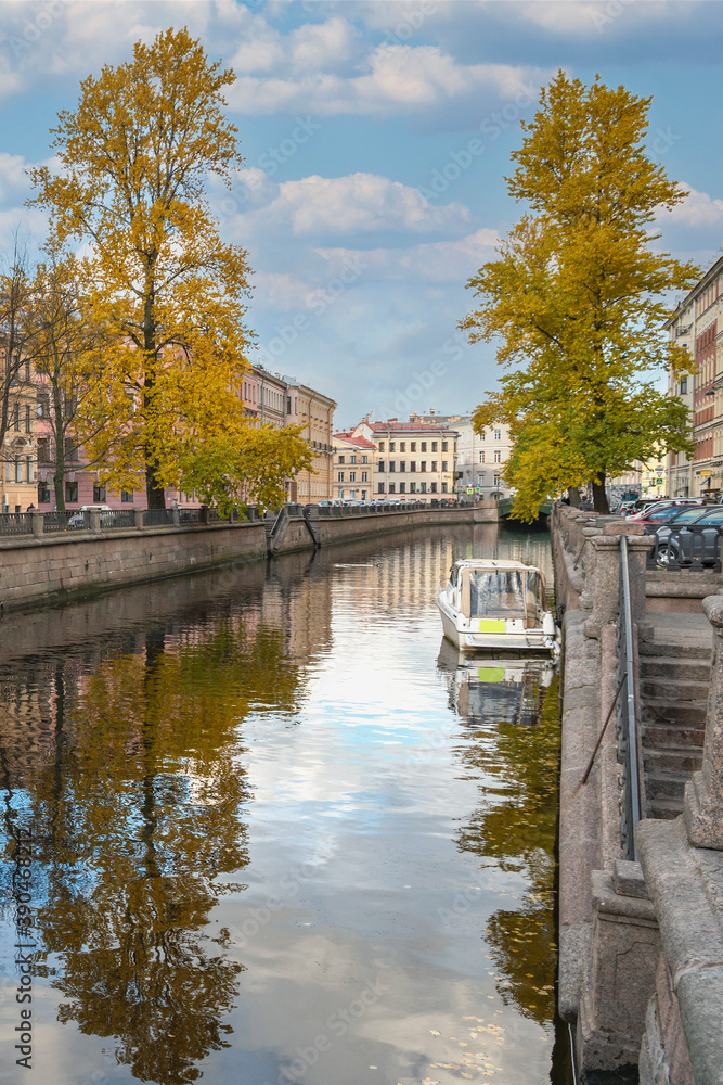 modern motor boats are parked on the Griboyedov Canal in the historic center of St. Petersburg
