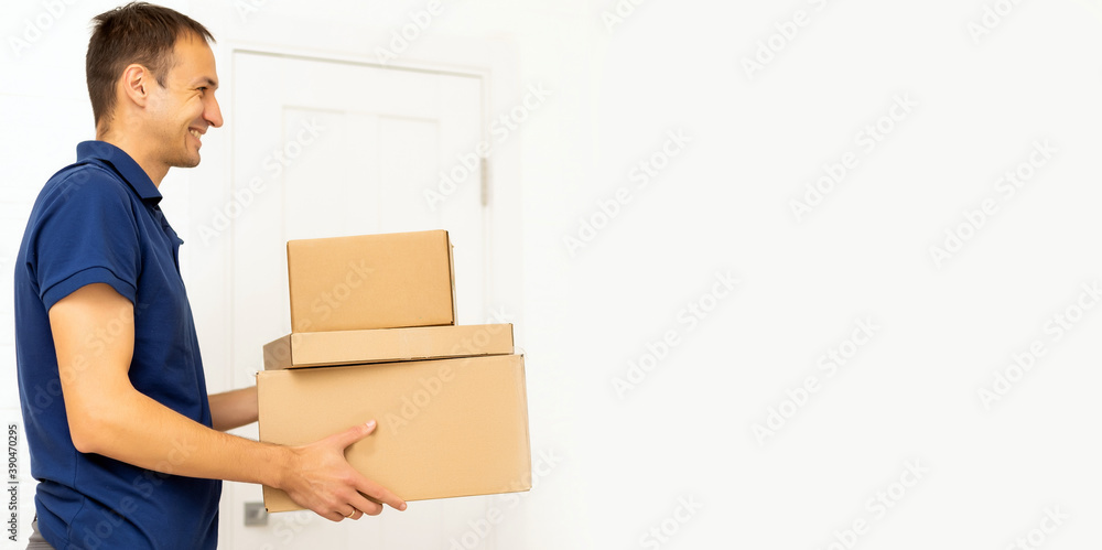Smiling delivery man giving boxes to woman customer at home for online shopping service concept Smiling delivery man giving boxes to woman customer at home for online shopping service concept