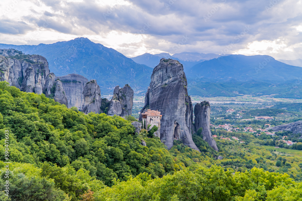 Amazing panoramic sunset view of the Valley of Meteora, Thessaly, Greece with Rousanou Monastery