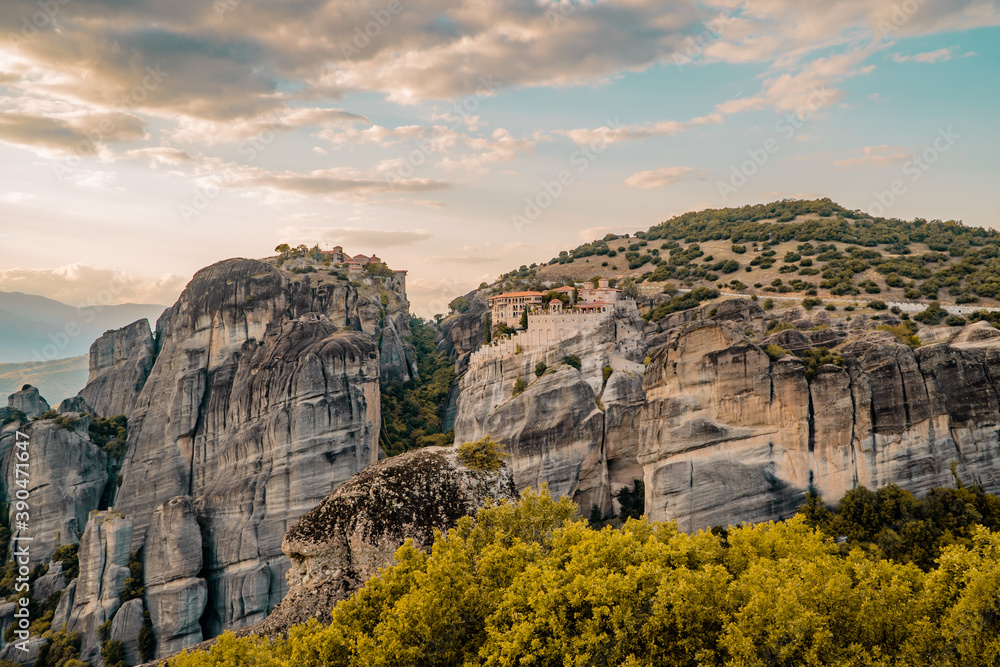 Amazing panoramic sunset view of the Valley of Meteora, Thessaly, Greece with monasteries and unique rock formations