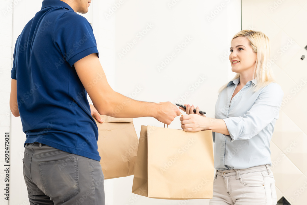 Delivery man holding cardboard boxes. Fast and free Delivery transport . Online shopping and Express delivery . Quarantine Delivery man holding cardboard boxes. Fast and free Delivery transport . Online shopping and Express delivery . Quarantine