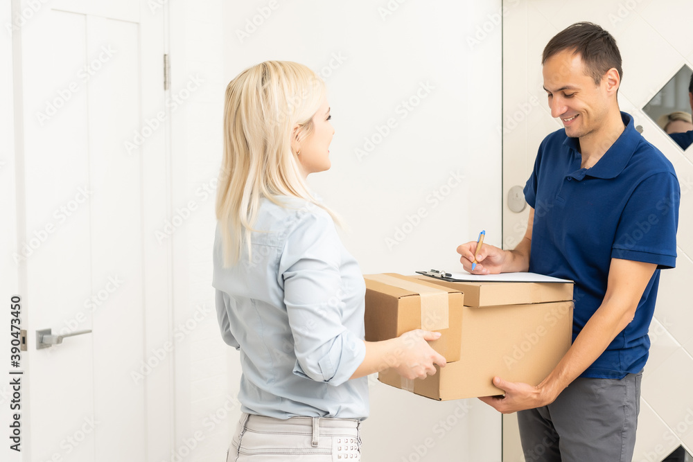 Woman sigining electronic receipt of delivered package Woman sigining electronic receipt of delivered package