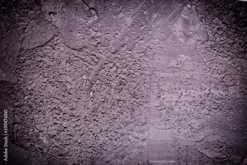 Dark background for atmospheric layouts. Wall with uneven plaster.