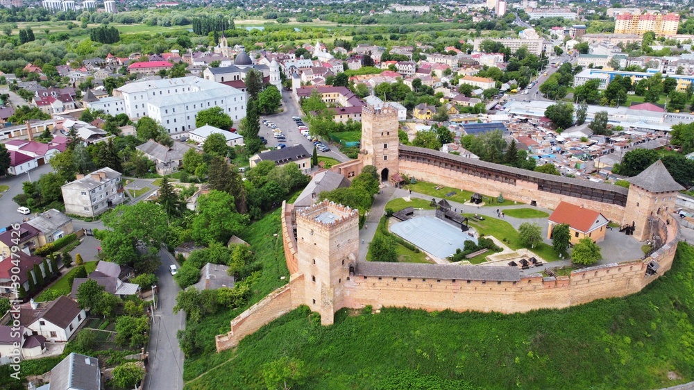 Lutsk, Ukraine - May, 2020: Aerial view on Medieval castle of Lubart in Lutsk.  Ukrainian landmark, domestic tourism.  Fortifications and courtyard.