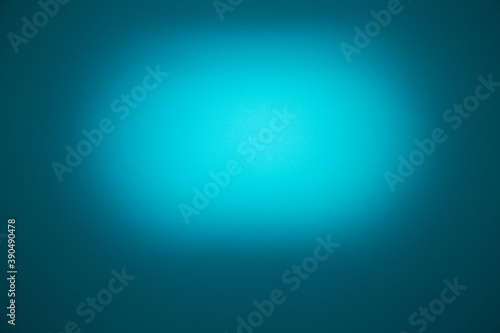 Light blue oval cloud of light on a dark turquoise background
