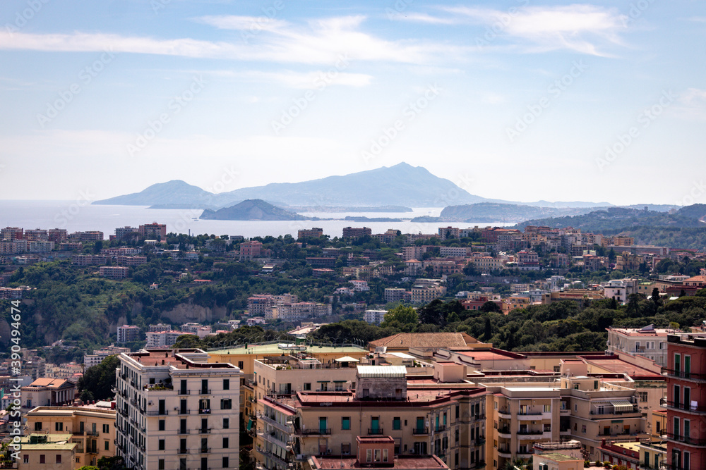 Scenic picture-postcard view of the city of Napoli Naples in the background in golden evening light at sunset, Campania, Italy