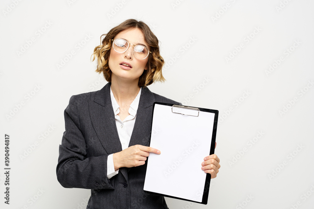 Woman in business suit finances work documents glasses hairstyle Woman in business suit finances work documents glasses hairstyle