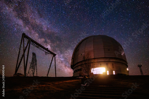 Special astrophysical observatory against starry night sky with milky way photo