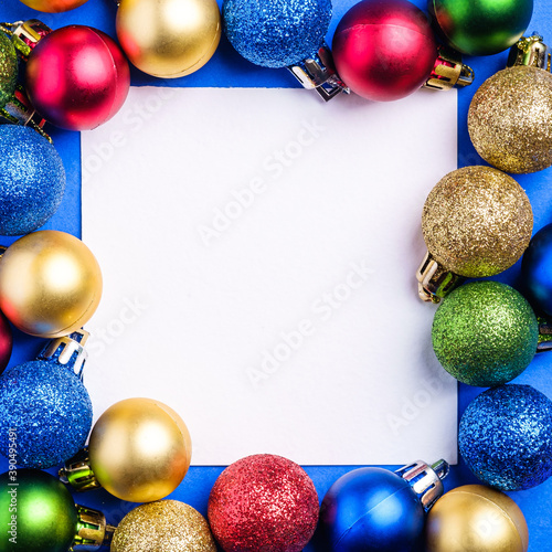 Christmas composition with white square copy space. Colorful ornament and baubles decorations. Mockup greetings card template