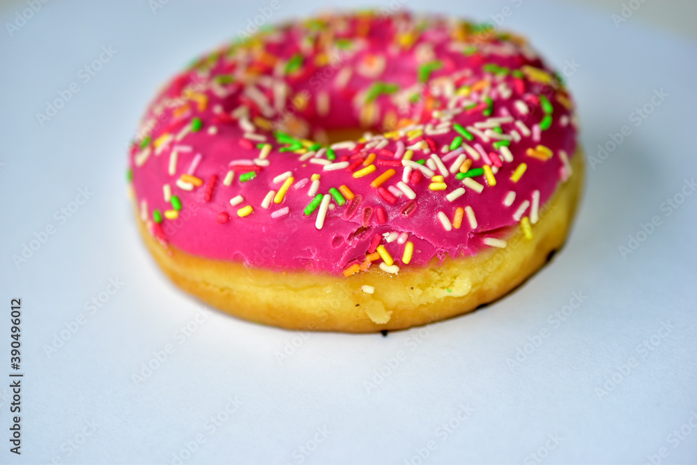 Yellow and red American delicious donut on a white background Yellow and red American delicious donut on a white background